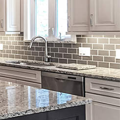 Subway tile backsplash in the kitchen of this Ballwin area home